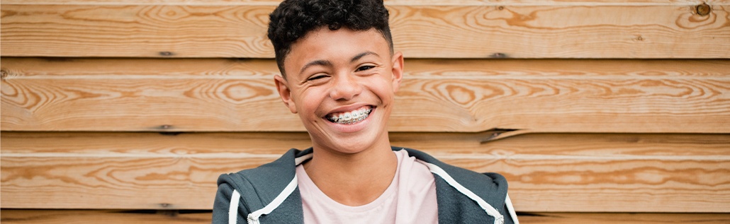 smiling boy with braces